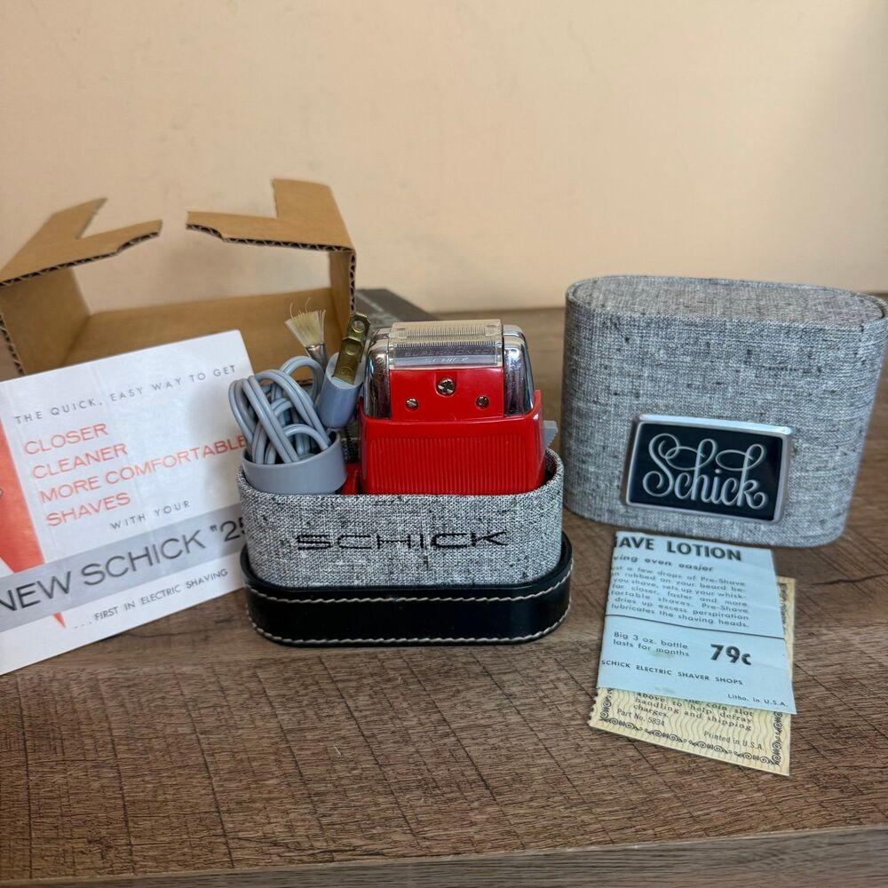 vintage Schick 25 electric shaver complete with original case and advertisements